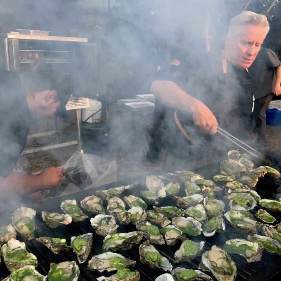 Man Grilling oysters at Clausen Paddy BBQ Oyster