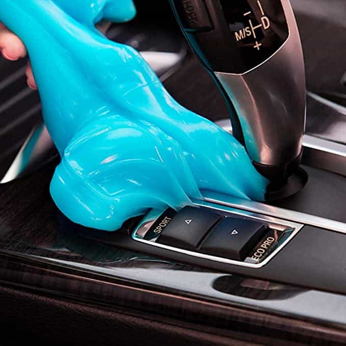 Cleaning gel cleaning a console of a car.