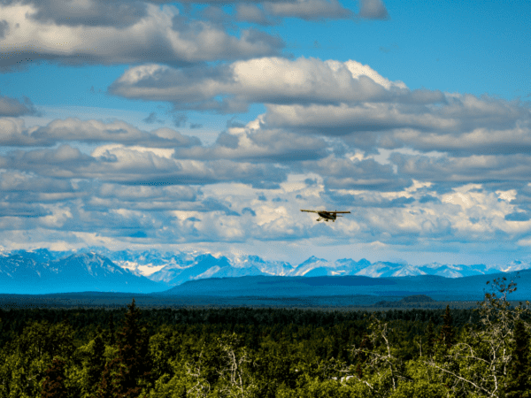 A seaplane flying over Alaska