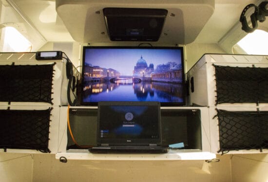 Mammoth Overland interior showing a tv and a laptop
