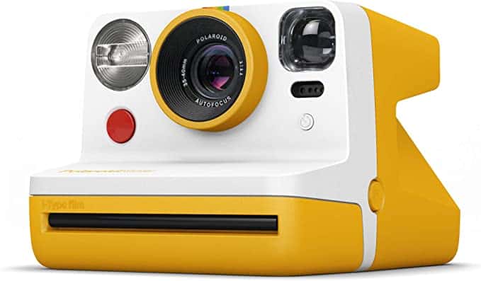  A yellow and white polaroid camera.