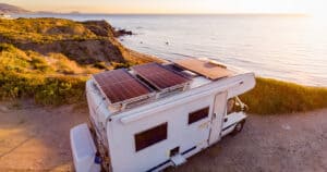 RV with RV solar panels overlooking the ocean.