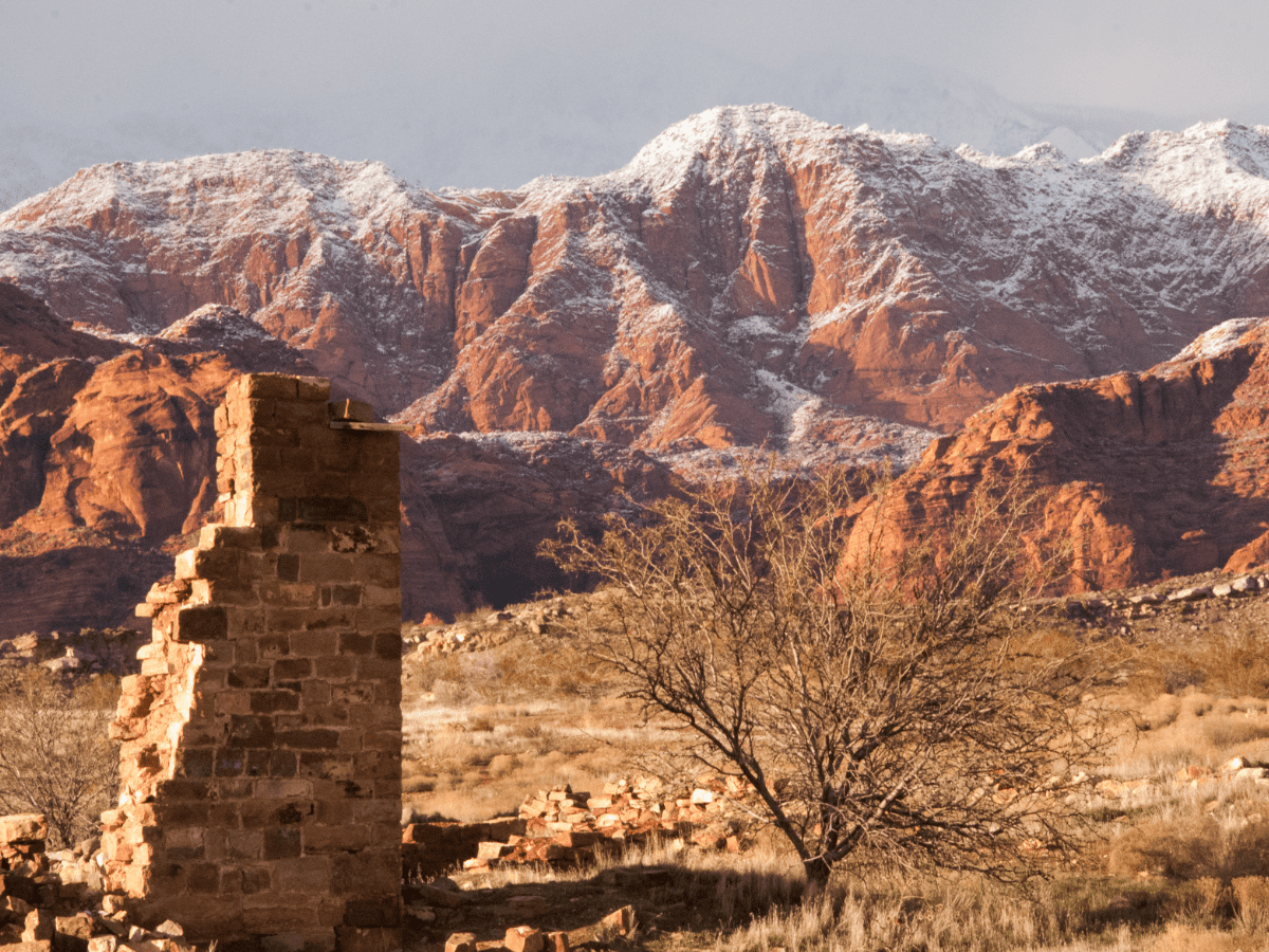 Snow-capped mountains in the background of ancient ruins at Red Cliffs.