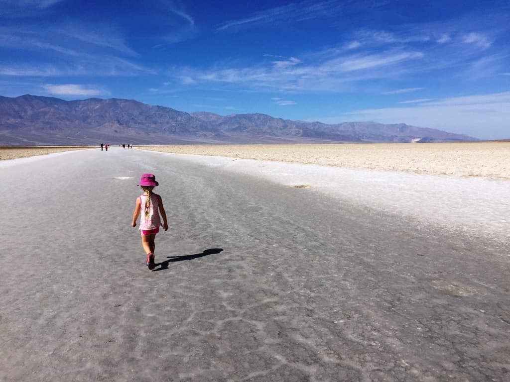 child walking on sand at Death Valley National Park