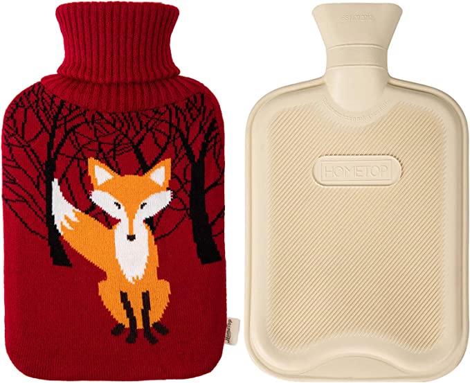 A hot water bottle heater with a cute fox sweater cover.