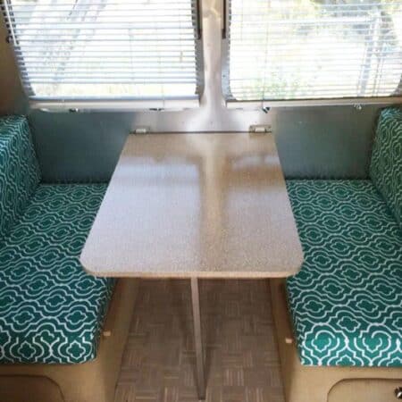 An RV dining table with bench seating.