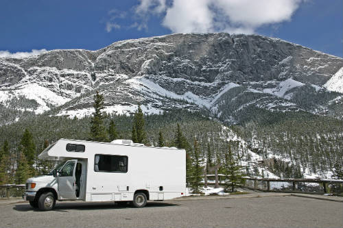 Class C motorhome in front of mountains