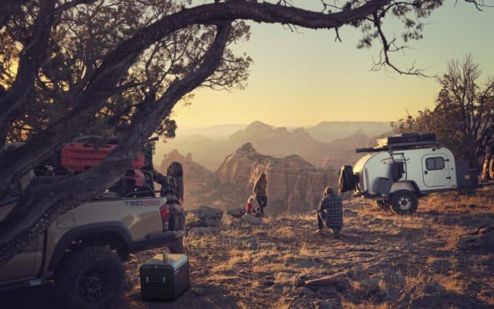 Family camping overlooking valley with various Dometic products.