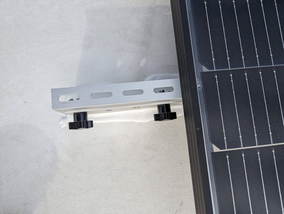 Solar panel mounting bracket showing thumb screws.