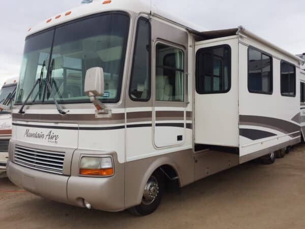 Newmar made RV history with the first slideouts in this Mountain Aire RV, shown in dealer lot.