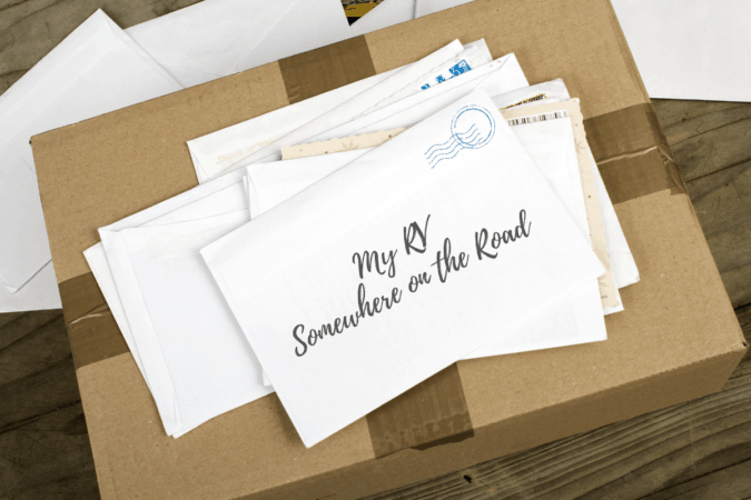 stack of letters and parcel that read "My RV Somewhere on the Road" - how to receive mail when living in an RV full-time