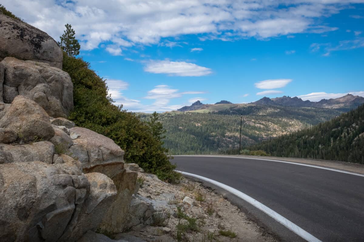 View of boulders and high mountain range along the Ebbetts Pass Scenic Byway, considered one of the most dangerous roads for RV travel
