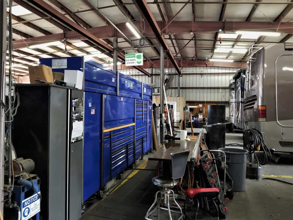Inside view of an RV repair shop shows the contrast to a mobile rv repair technician.