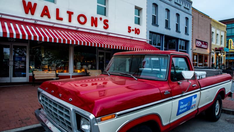 Red and White pickup truck that belonged to Sam Walton, founder of Walmart, parked in front of his first five and dime store (now a corporate museum).