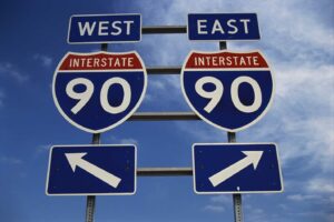 This is a road sign on the New York State Freeway. It points out the direction for Route 90 to go east or west.