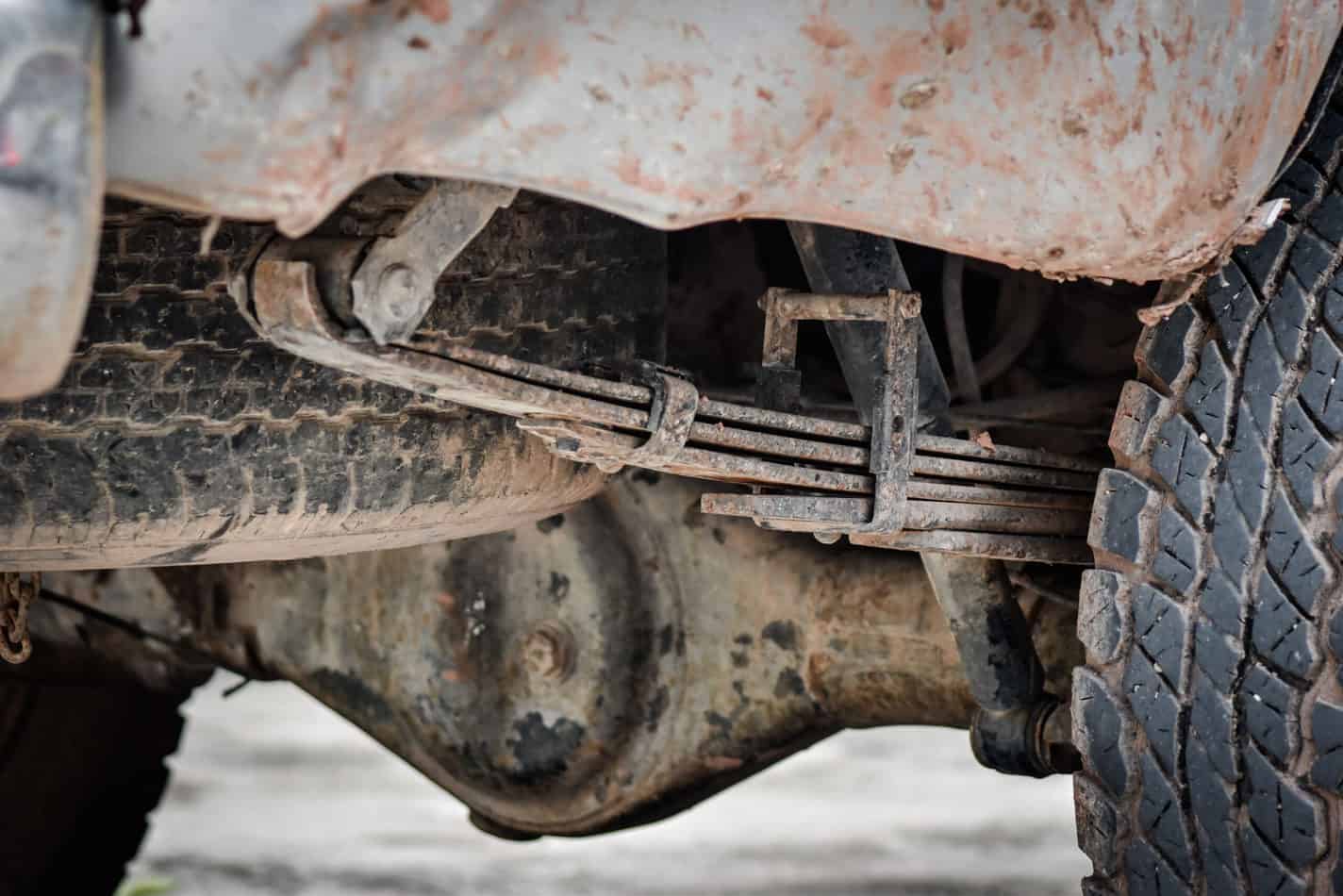 Close up view of broken truck suspension - truck squats when towing