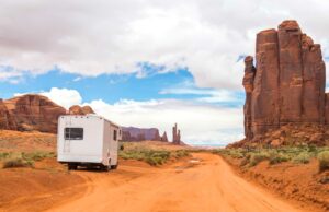 RV parks in Monument Valley on dirt road.