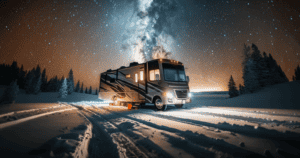 An RV parked amidst a snowy landscape under a breathtaking starlit sky with the Milky Way galaxy overhead.